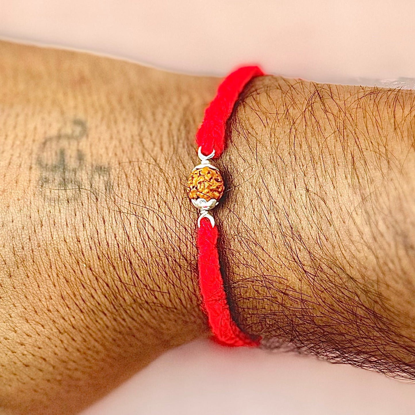 Silver Rudraksha Rakhi ( 1 Rudraksha )