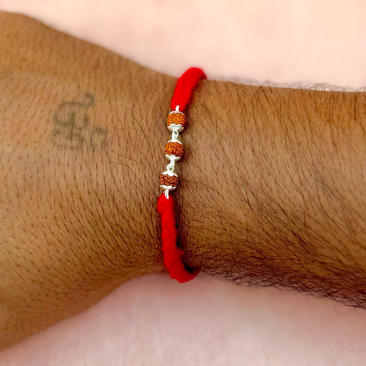 Silver Rudraksha Rakhi ( 3 Rudraksha )